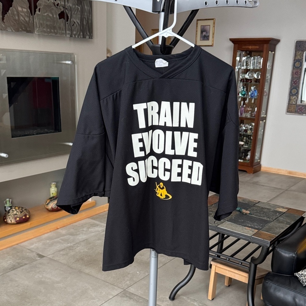 The Staubar Black hockey youth goalie shirt